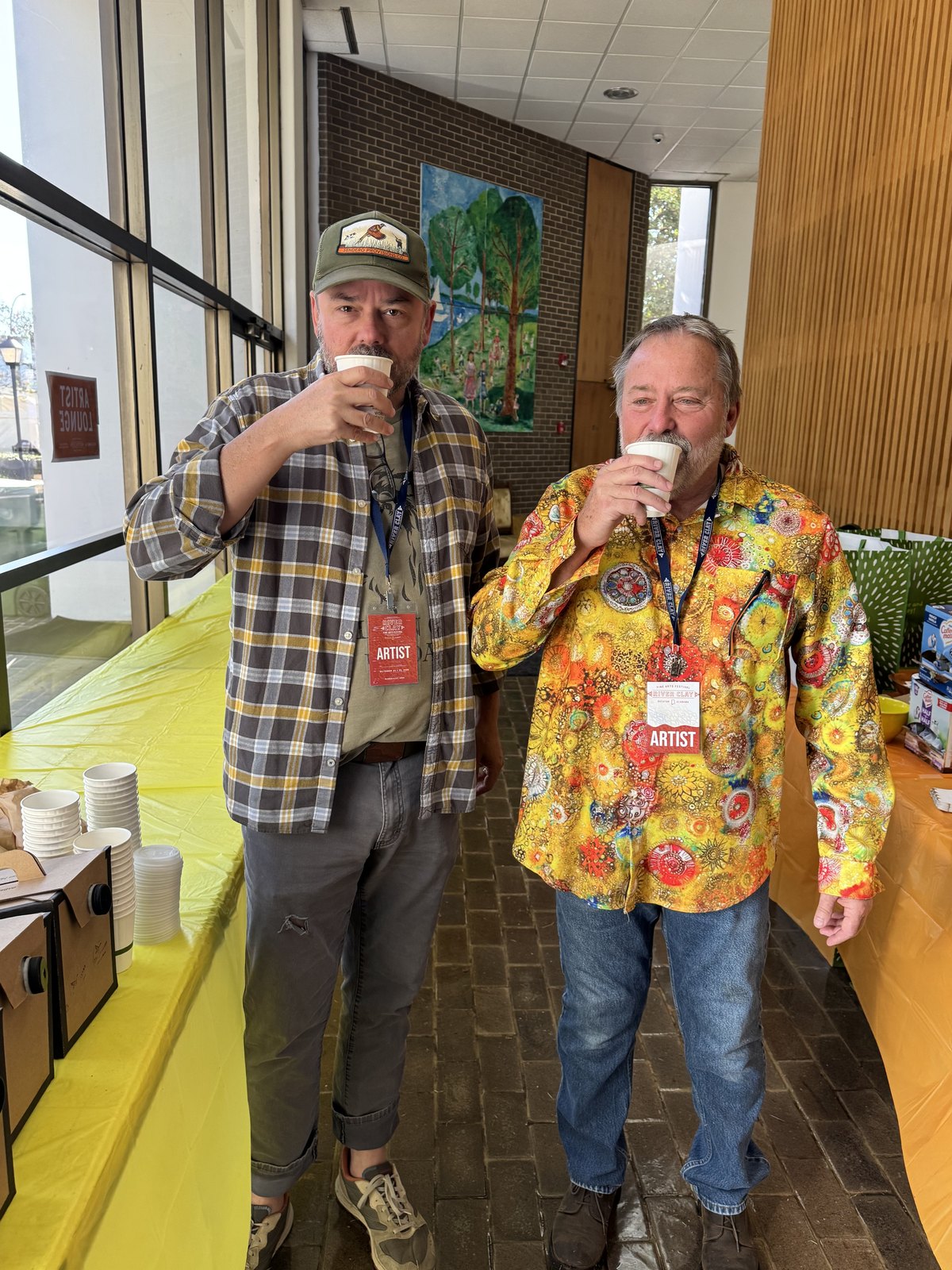 Two River Clay guests enjoy artwork together indoors