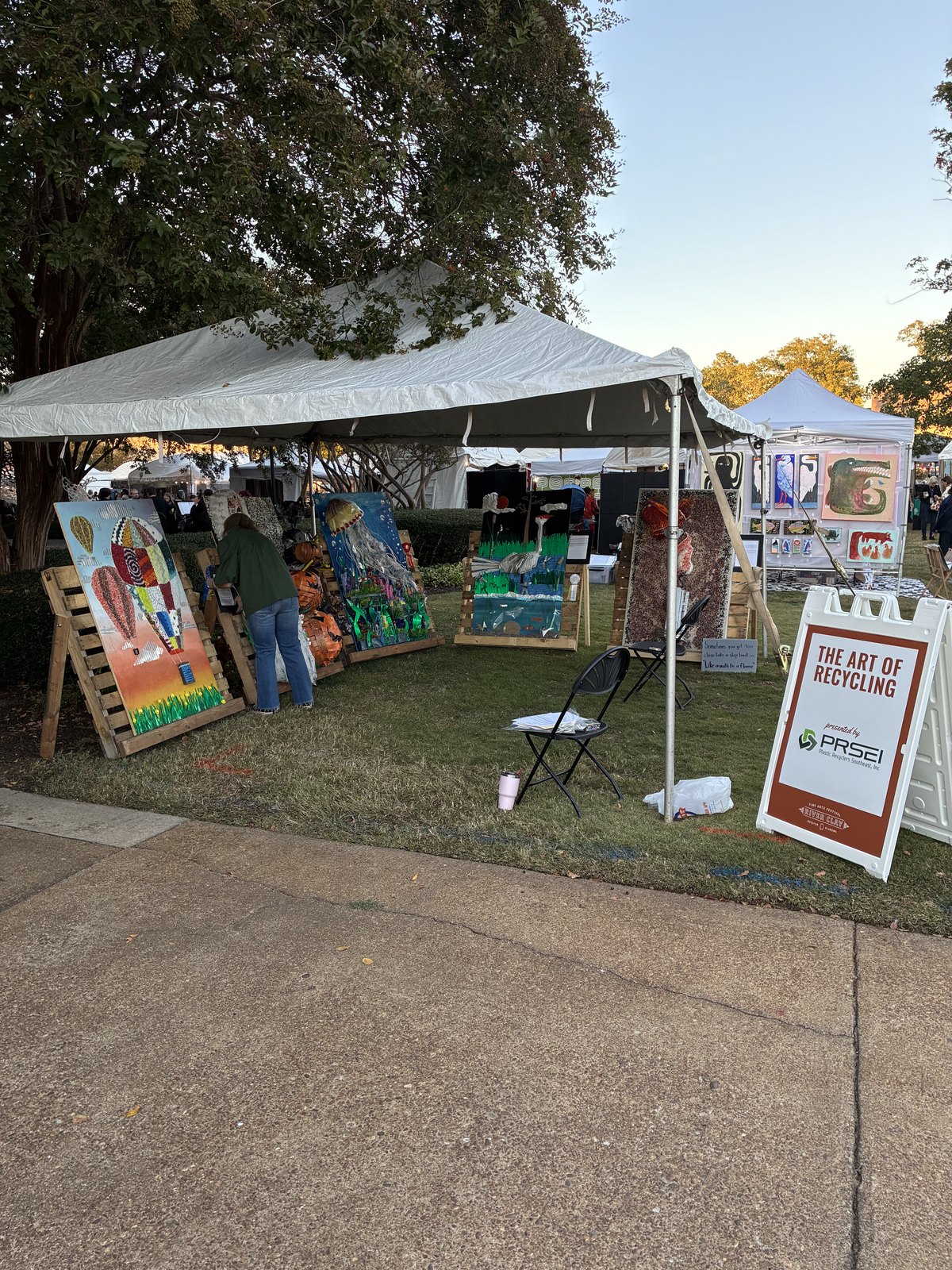 Artist tents and original artwork at the River Clay 2026 outdoor market